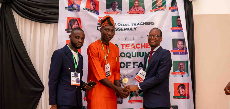 An educator receiving an award from GTA